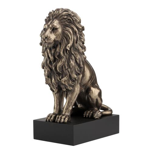 Lion sitting on plinth