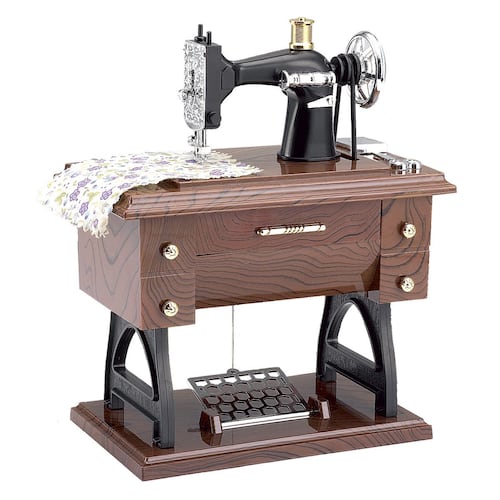Figura de maquina de coser con música