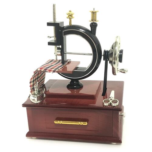 Figura maquina de coser antigua musical