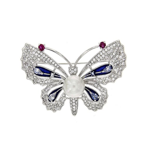 Broche mariposa con circonita redonda cristal, perla blanca y esmalte azul, con acabado en rodio