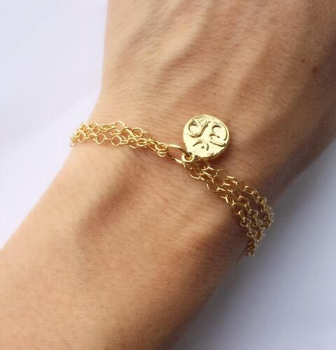 Pulsera OM- Baño de Oro 18K-Dorada .