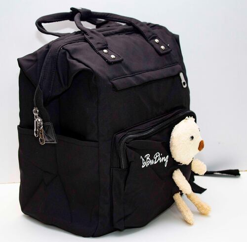 Mochila Bolsa en tela con varios compartimentos para escuela o usos varios. Decorativo con oso de felpa. 