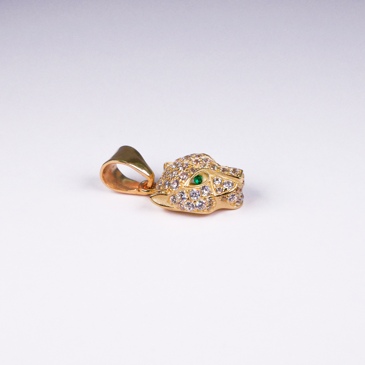 Dije jaguar de oro 10k piedra zirconia .