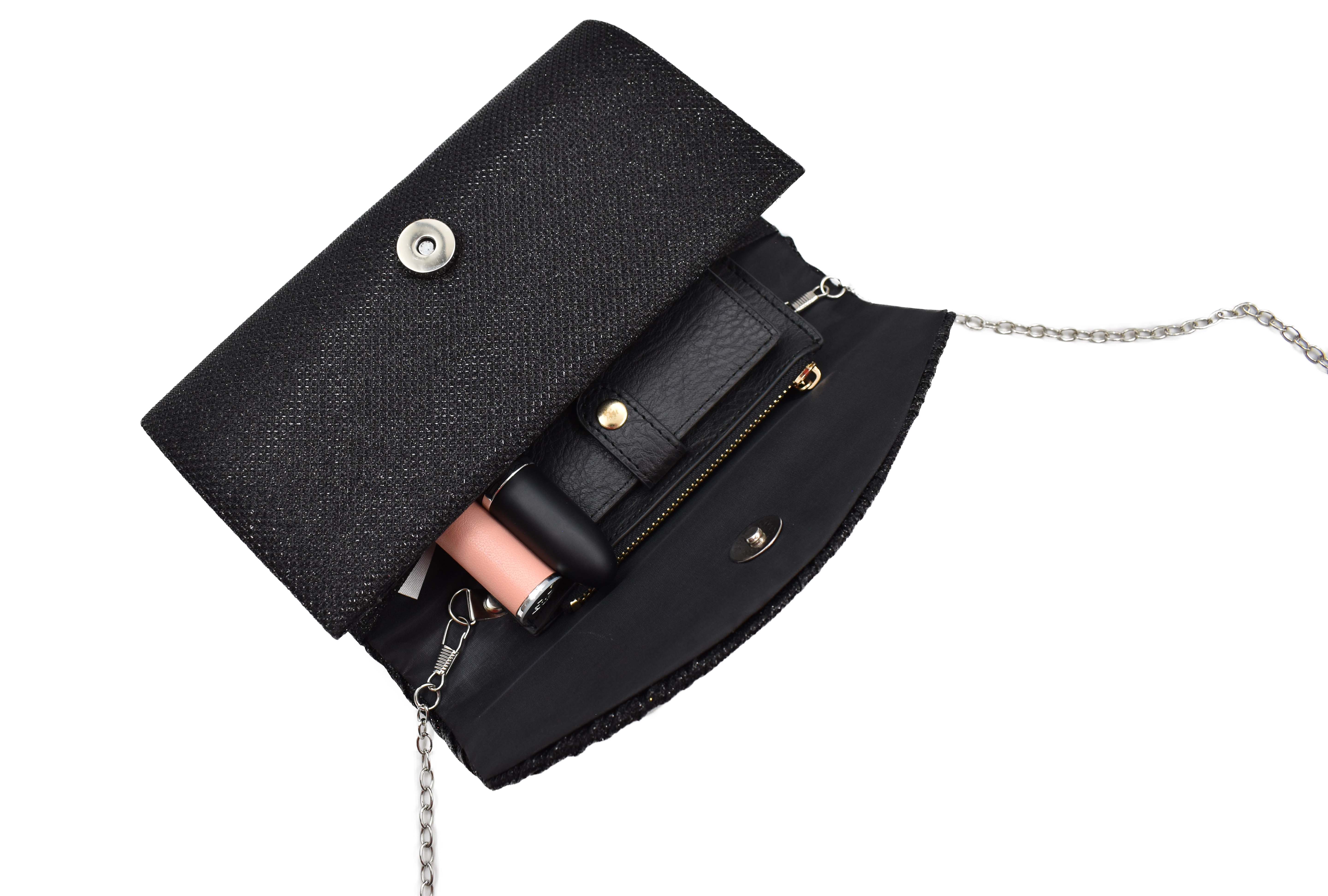 Bolsa clutch negro con detalle de líneas y brillos 
