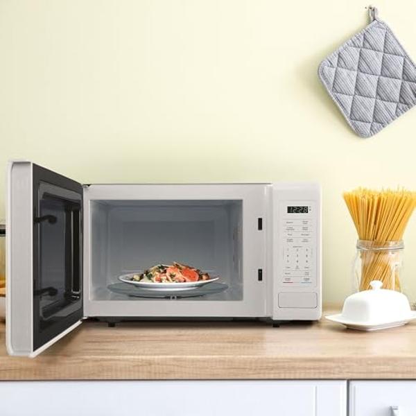 Horno microondas pequeño de encimera Magic Chef de acero inoxidable de 900 vatios y 0.9 pies cúbicos para espacios compactos con 6 modos de cocción preprogramados, color blanco